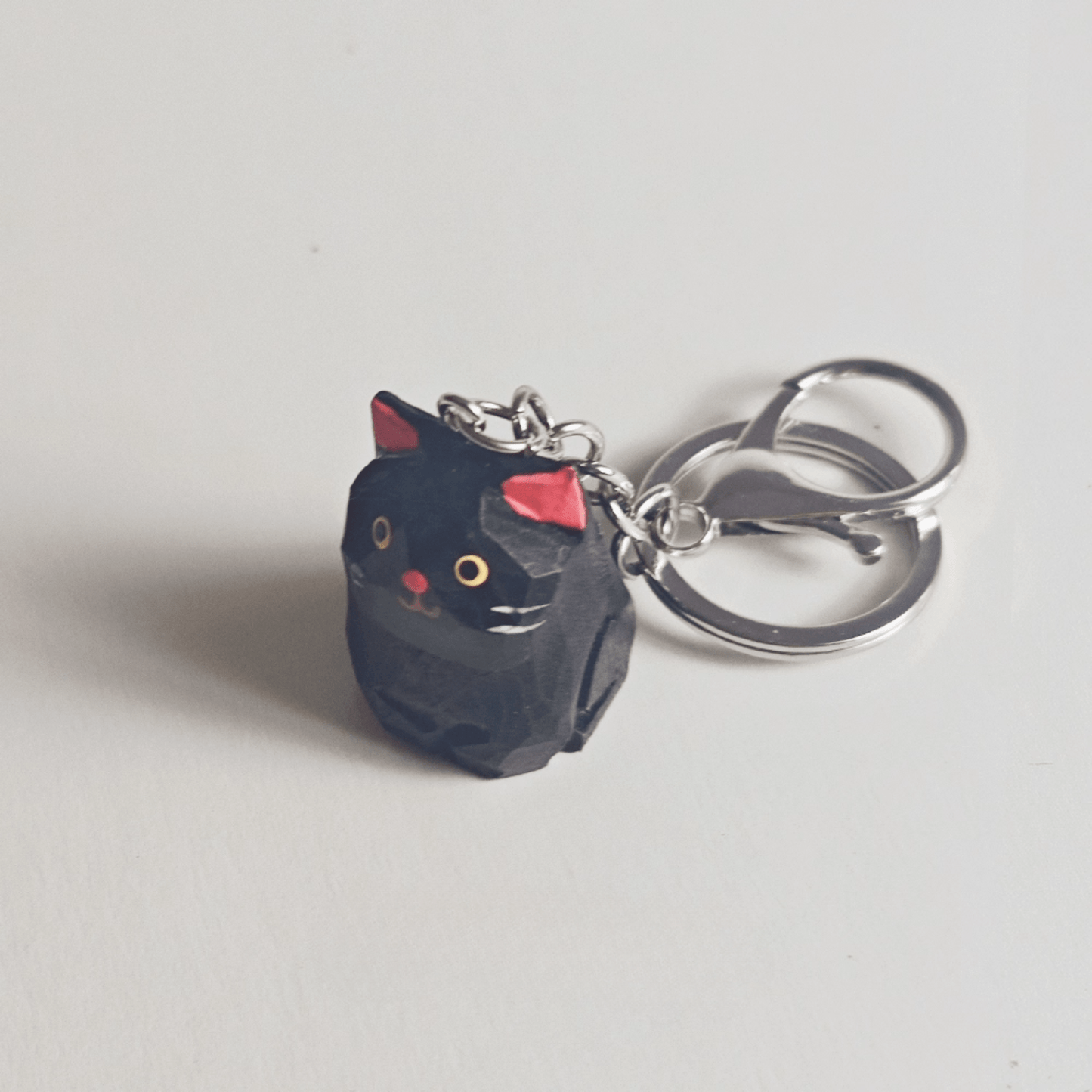 Handcrafted Black Kitty Keychain: Elegance & Nature Combined - REVEALME