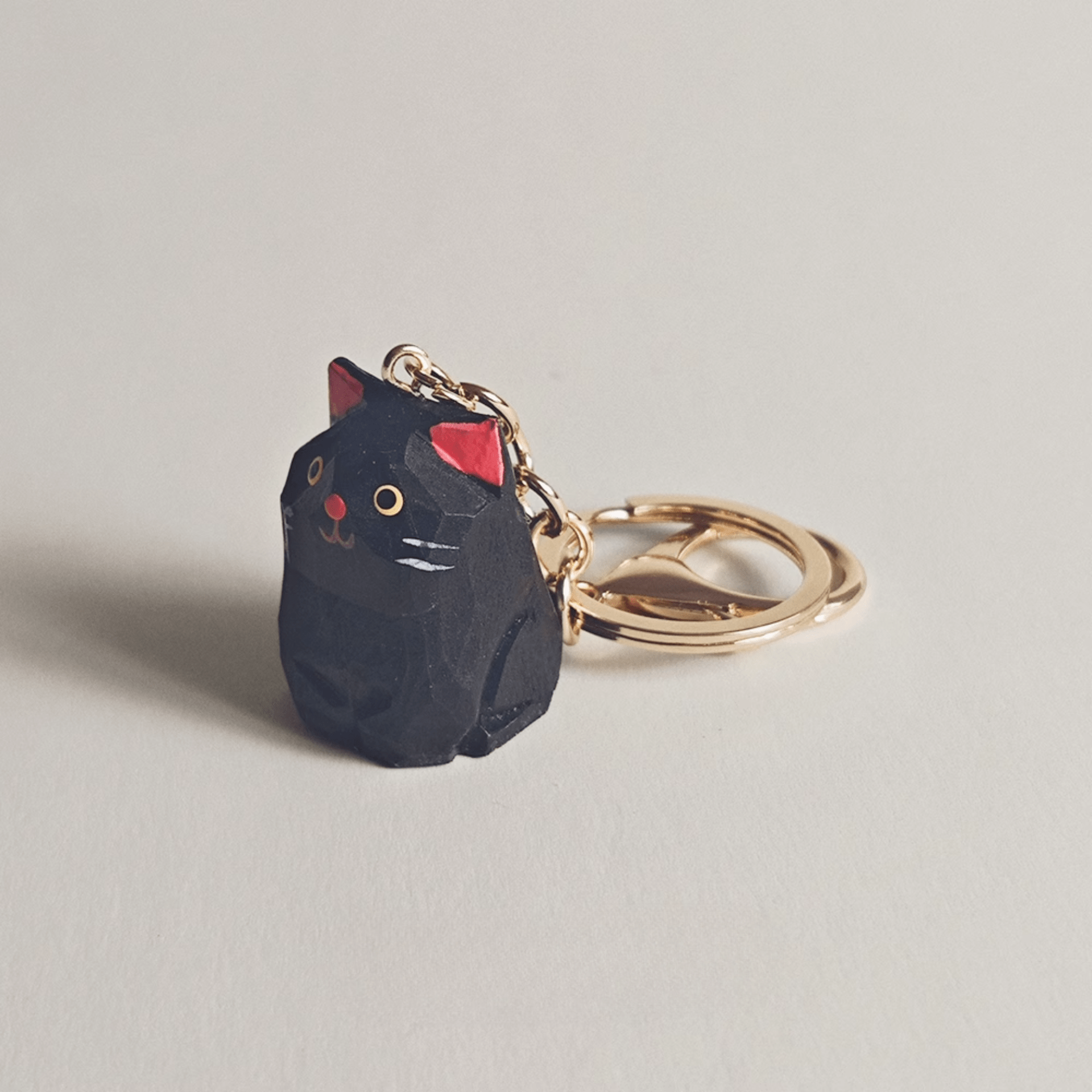 Handcrafted Black Kitty Keychain: Elegance & Nature Combined