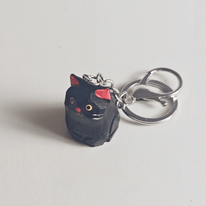 Handcrafted Black Kitty Keychain: Elegance & Nature Combined - REVEALME