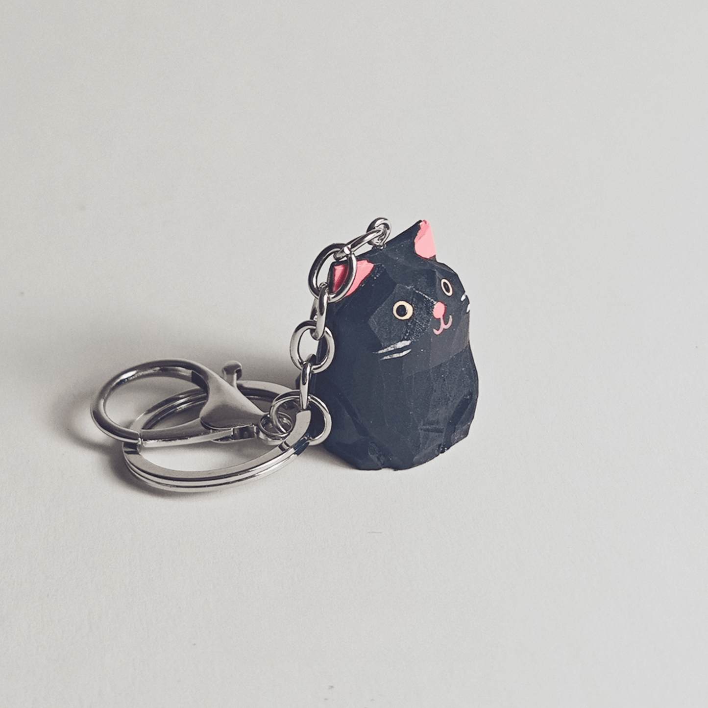Handcrafted Black Kitty Keychain: Elegance & Nature Combined - REVEALME